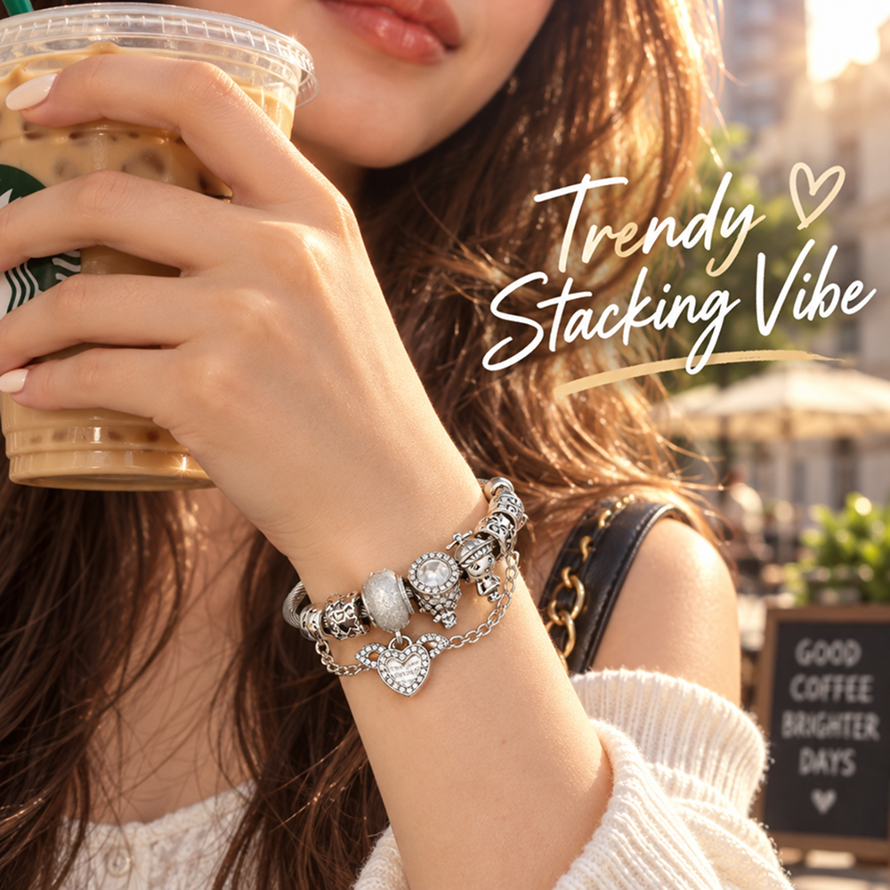 silver-tone charm bracelet with winged heart, decorative beads and cable texture