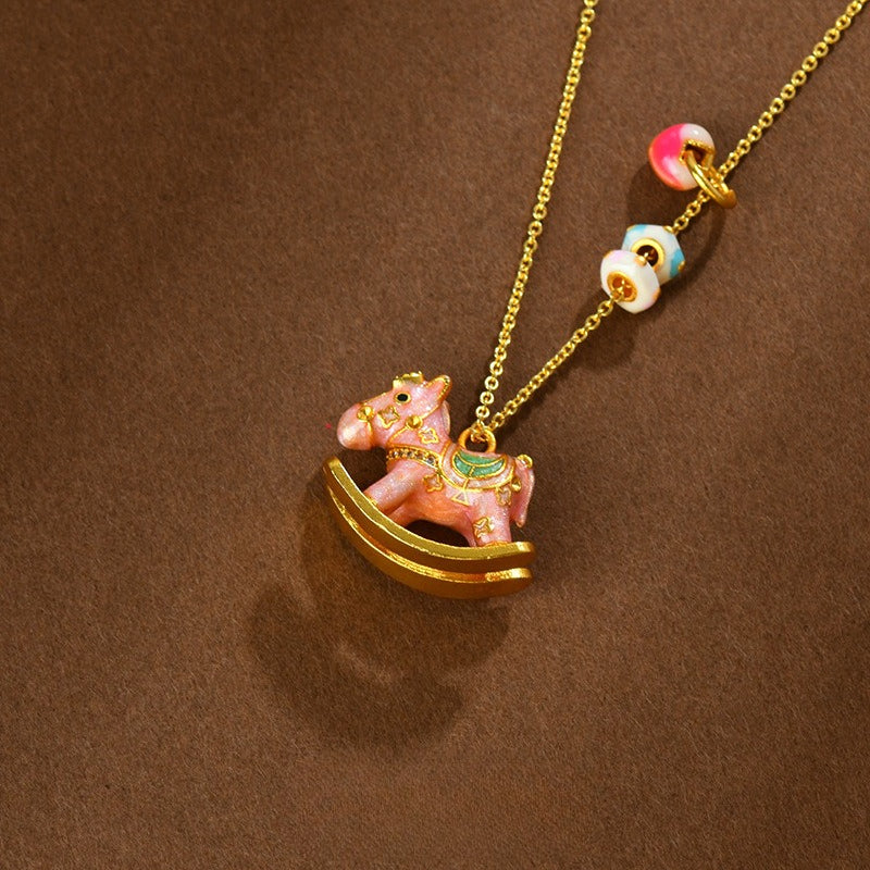 chinese zodiac enamel rocking horse necklace – pink macaron style with high-temperature enamel and gold accents - star8s