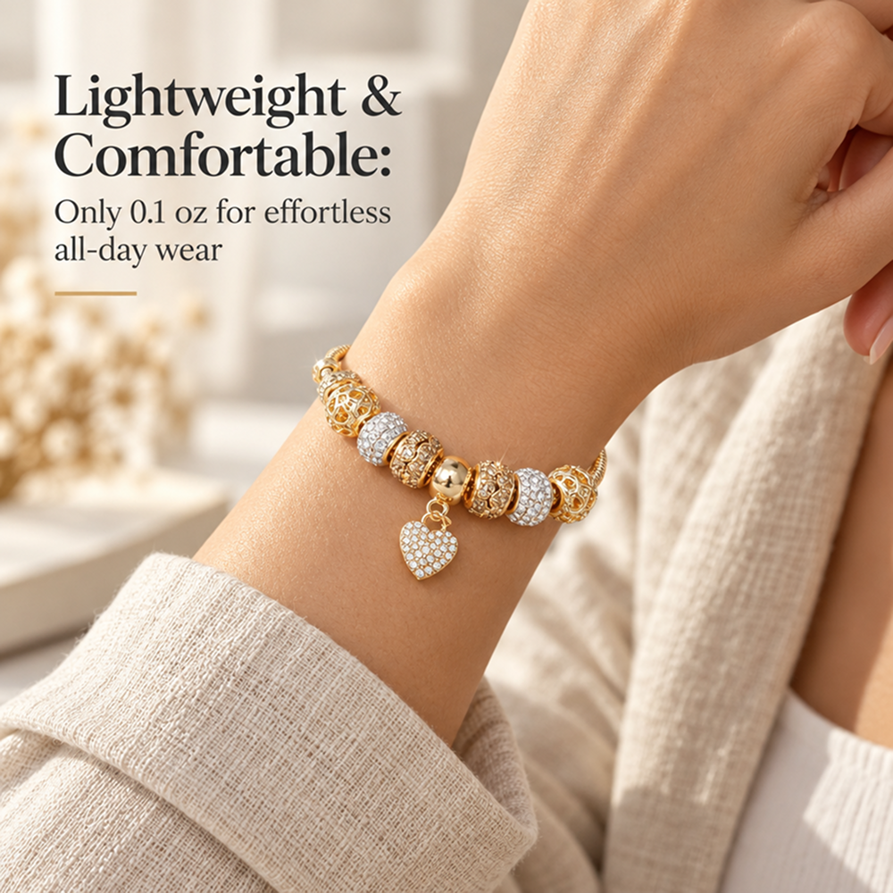 gold-tone heart charm bracelet with decorative beads and adjustable extender