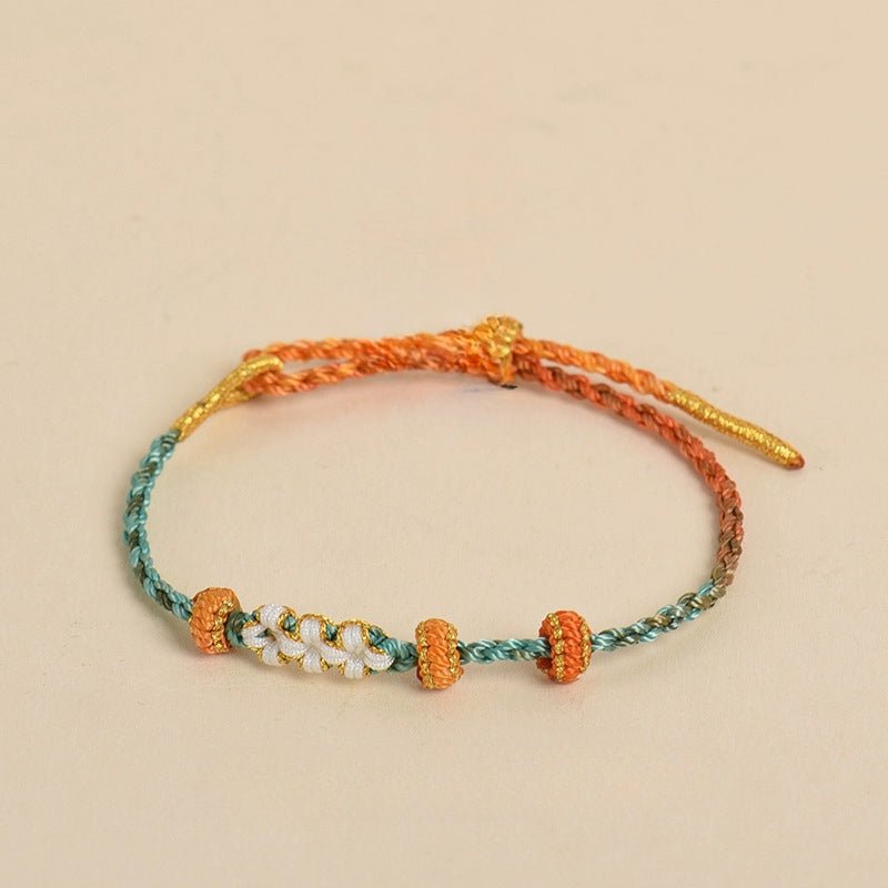 elegant handcrafted peach blossom knot bracelet – adjustable red cord & golden thread design | star8s