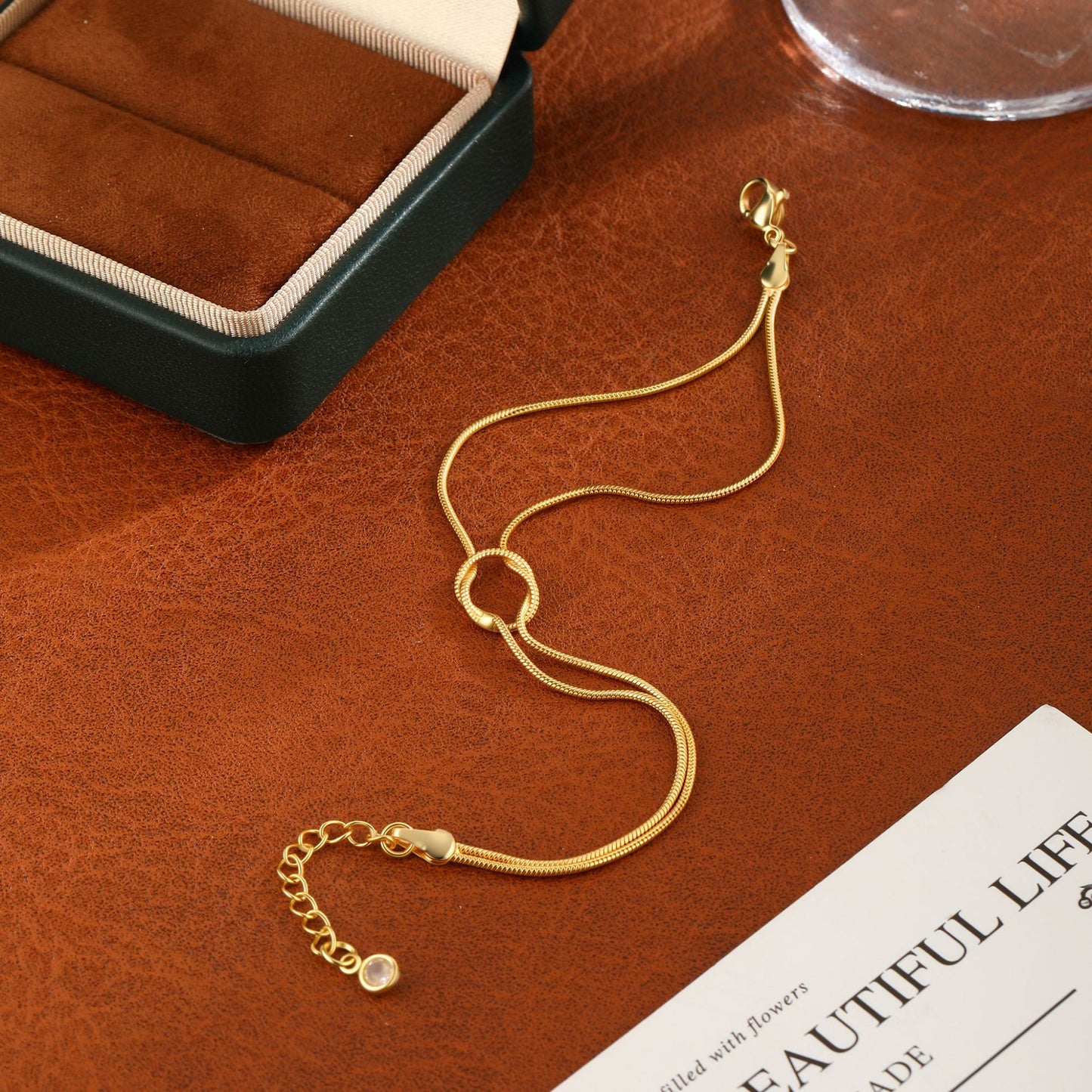 elegant tarnish resistant brass layered snake chain bracelet high polish infinitesimal love knot adjustable comfort fit smooth fluid bone link wristband premium romantic charm