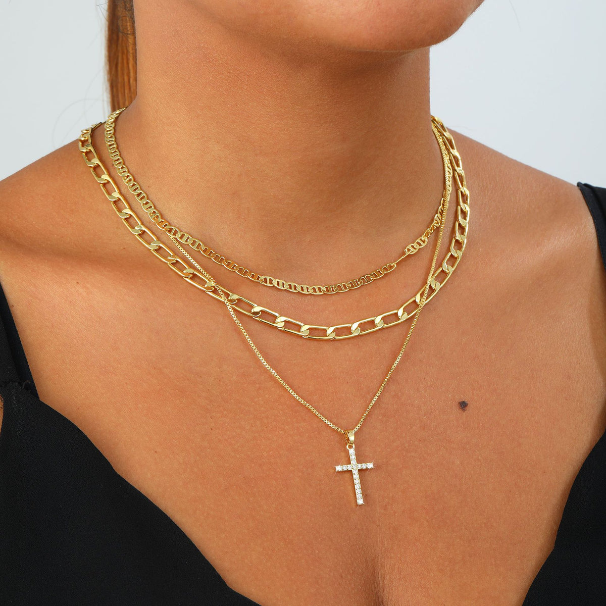 layered cross necklace set for women, 3 gold-tone electroplated brass chains with sparkling cross pendant, flat link and paperclip styles, 15, 16 and 18 inch lengths with 2 inch extenders, lobster clasps, everyday jewelry for blouses, dresses and swe
