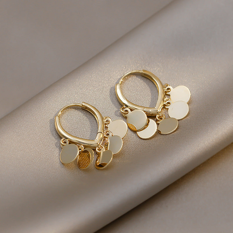 lightweight gold plated shimmering disc tassel hoop earrings gentle movement dainty dangle huggies comfortable everyday statement ear rings for sensitive ears