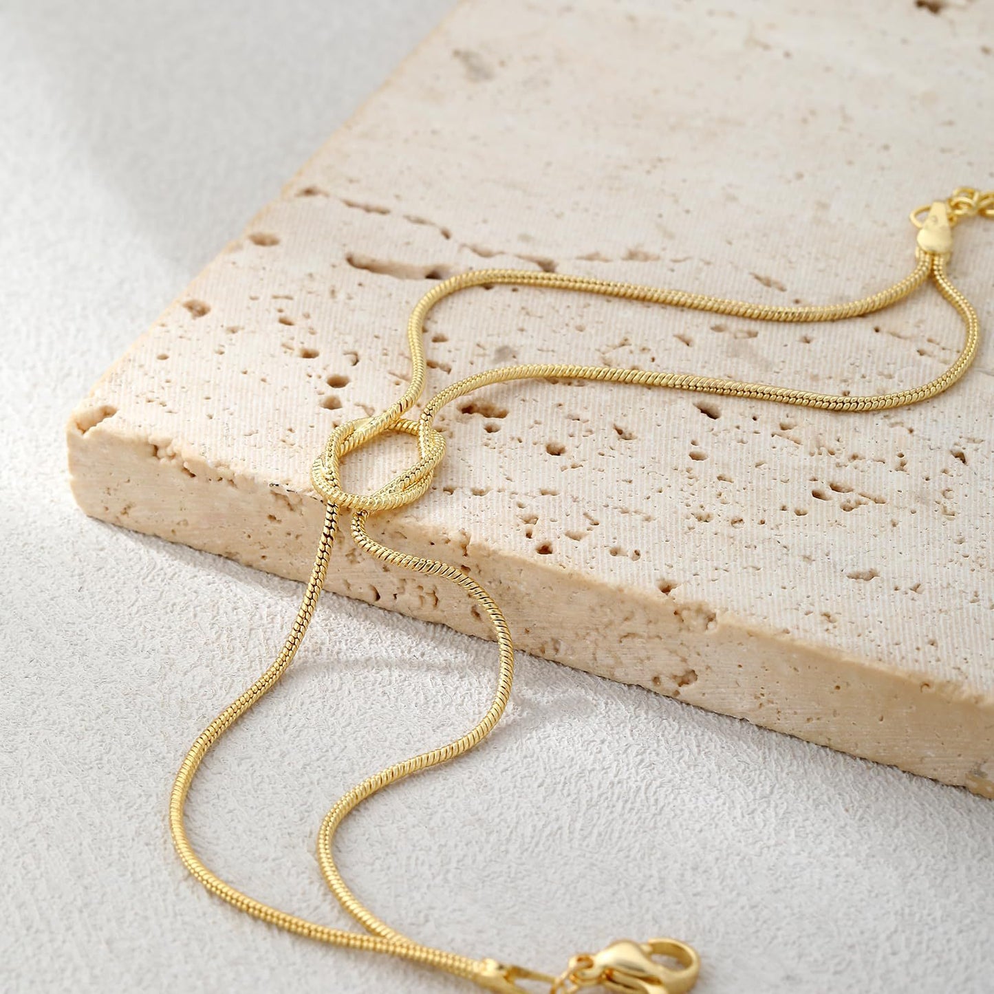 elegant tarnish resistant brass layered snake chain bracelet high polish infinitesimal love knot adjustable comfort fit smooth fluid bone link wristband premium romantic charm