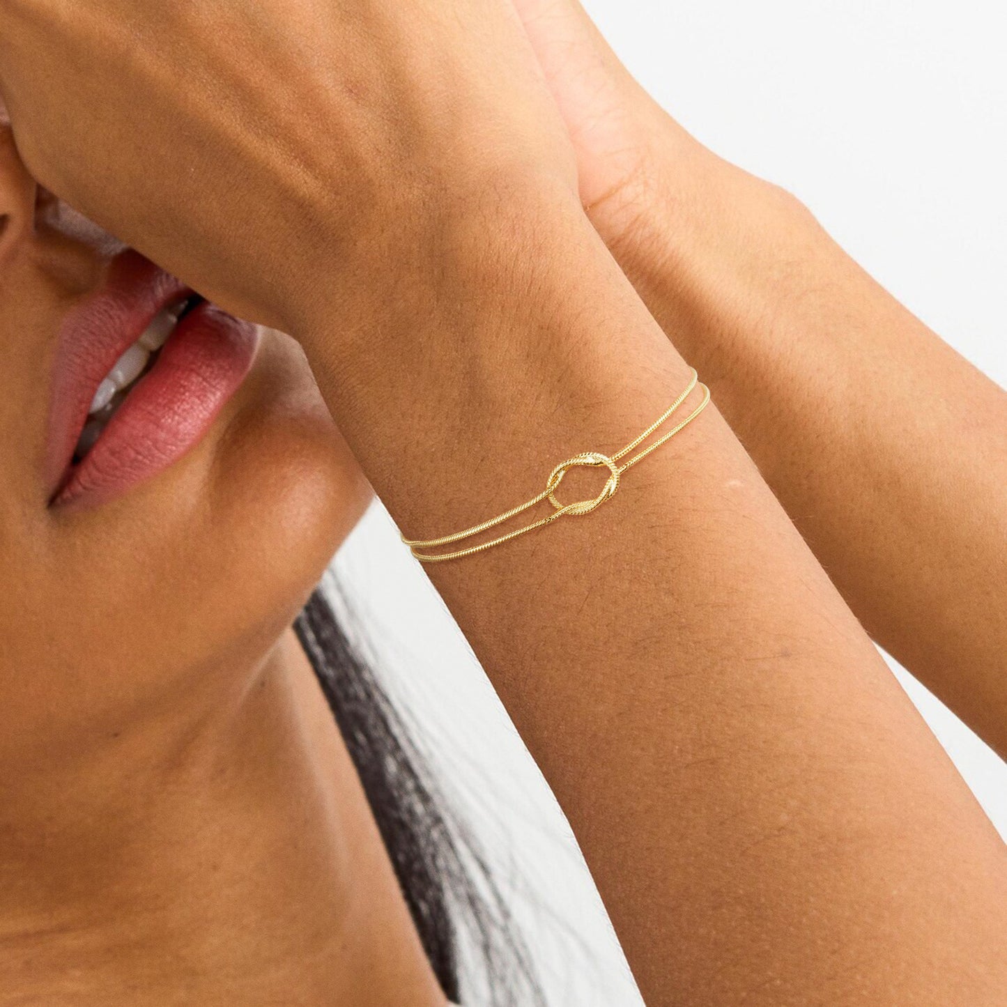 elegant tarnish resistant brass layered snake chain bracelet high polish infinitesimal love knot adjustable comfort fit smooth fluid bone link wristband premium romantic charm