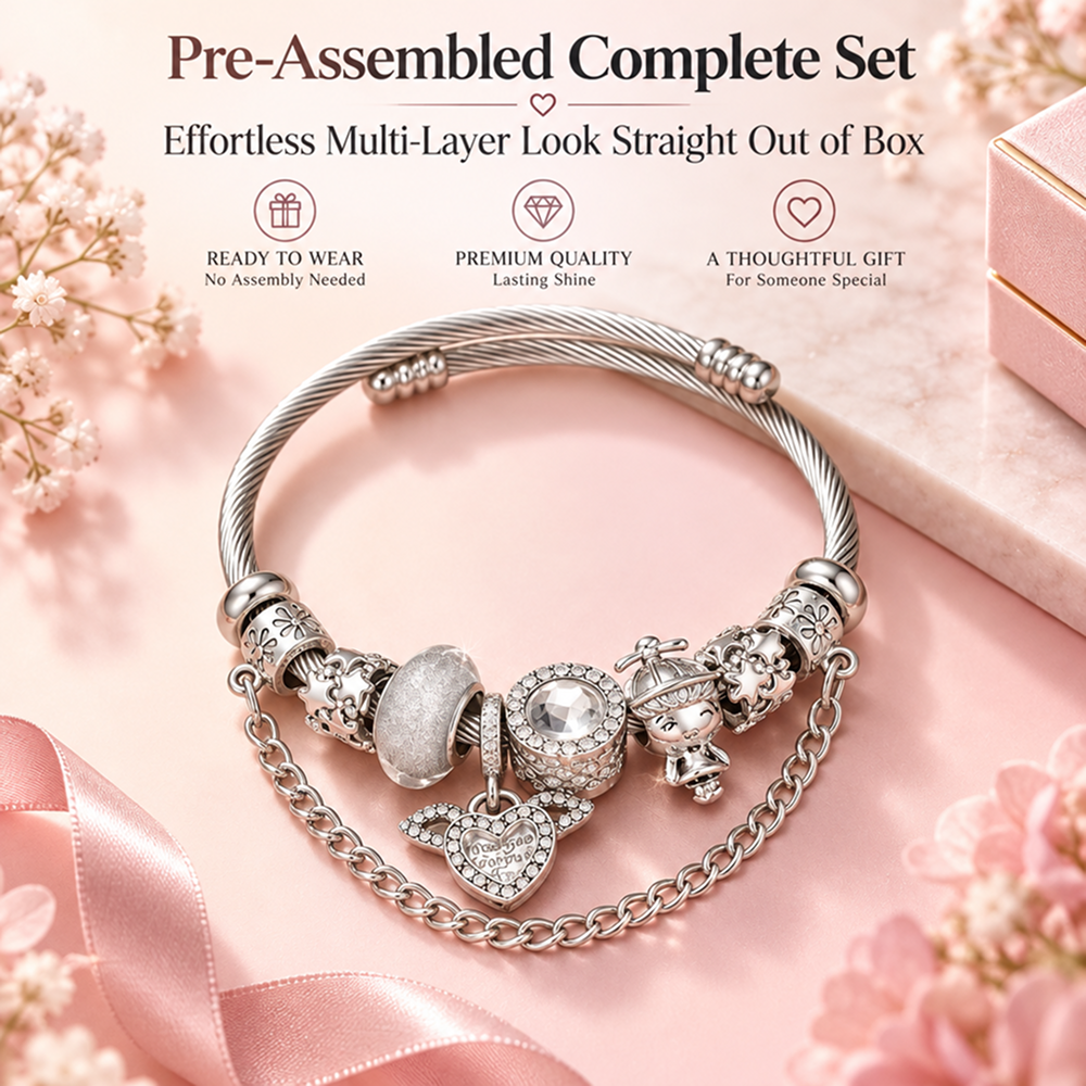 silver-tone charm bracelet with winged heart, decorative beads and cable texture