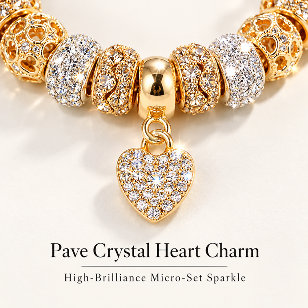 gold-tone heart charm bracelet with decorative beads and adjustable extender