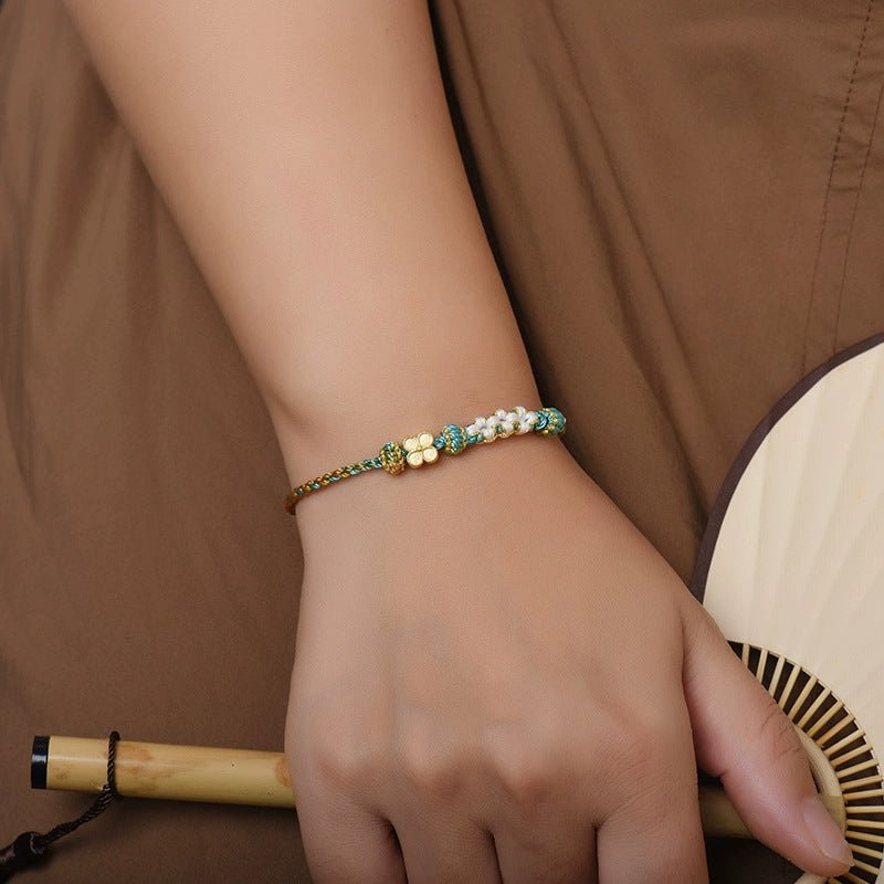 elegant handcrafted peach blossom knot bracelet – adjustable red cord & golden thread design | star8s