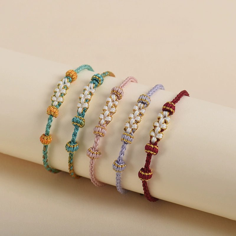 elegant handcrafted peach blossom knot bracelet – adjustable red cord & golden thread design | star8s