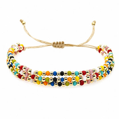 Three-Strand Beaded Bracelet for Women, Glossy Multicolor Beads with Gold-Tone Round Beads, Adjustable Sliding Knot Cord Closure, Boho Vintage Style Layered Design with Dangling Cord Ends, Colorful Jewelry for Everyday Wear, Vacations and Birthday Gi